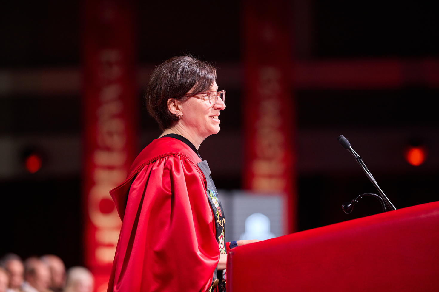 Female Professor speaking at podium