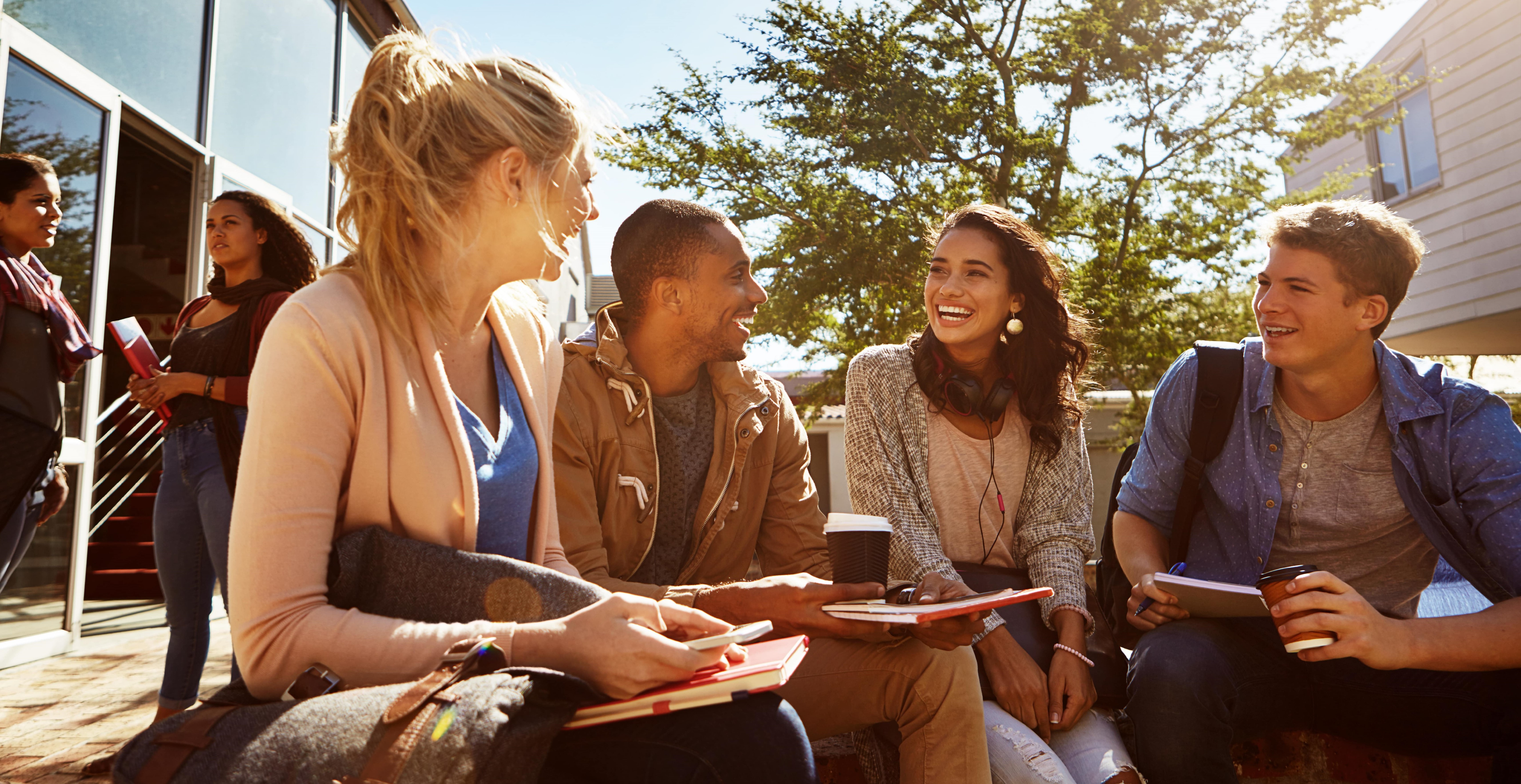 Shot of a group of students studying outside on campus.