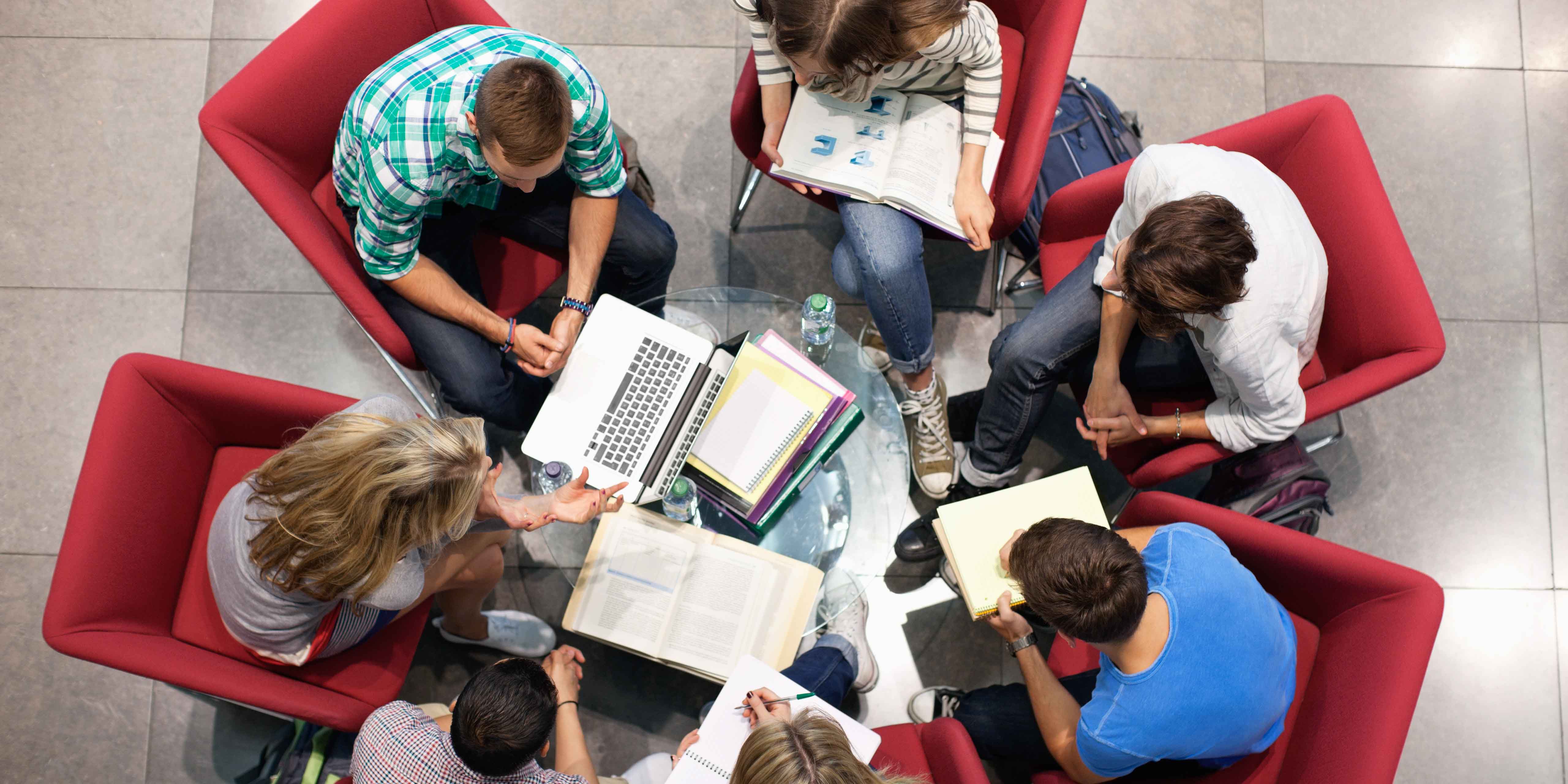 university students working in a circle on collaborative work