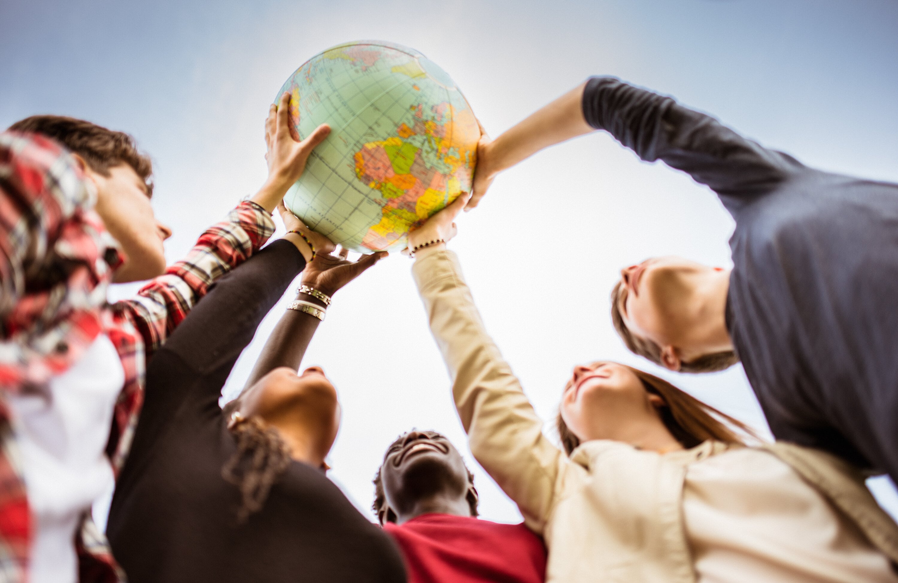 a picture with the students and the globe