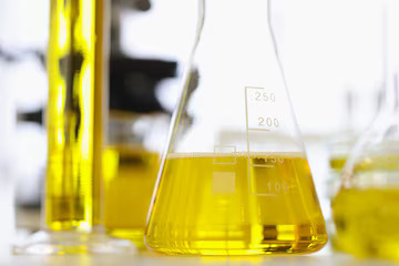 Lab glassware filled with yellow media