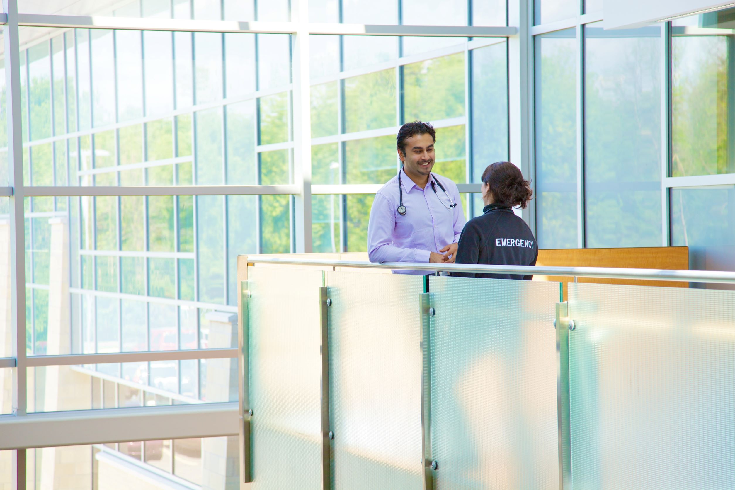 Resident and staff speaking one on one