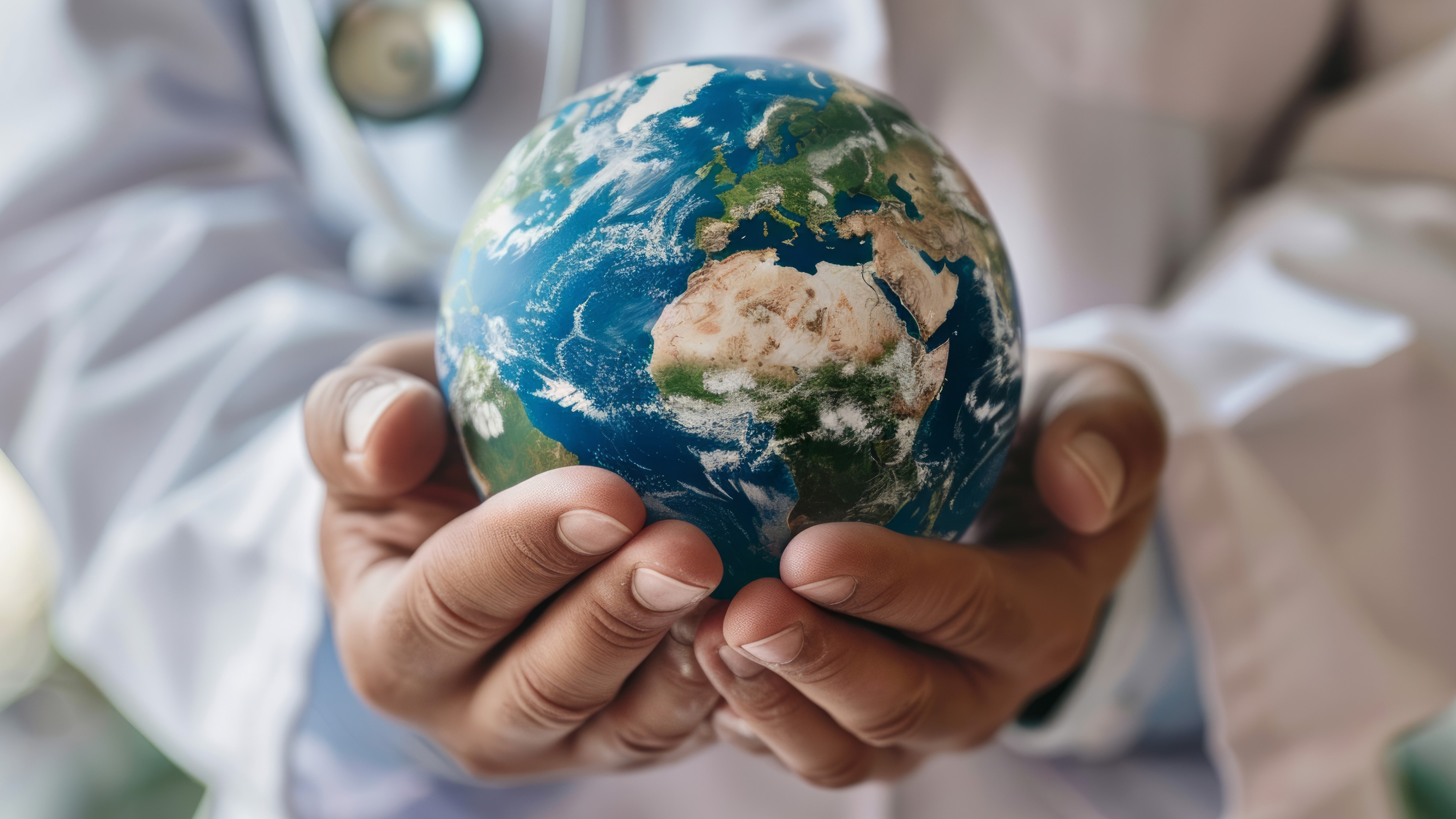 an earth model on hands
