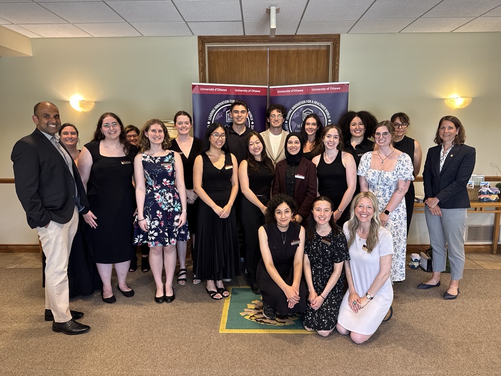 Support staff and professors, as well as volunteer students standing together at Pinecrest