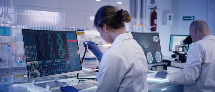Female scientist in a lab studying DNA