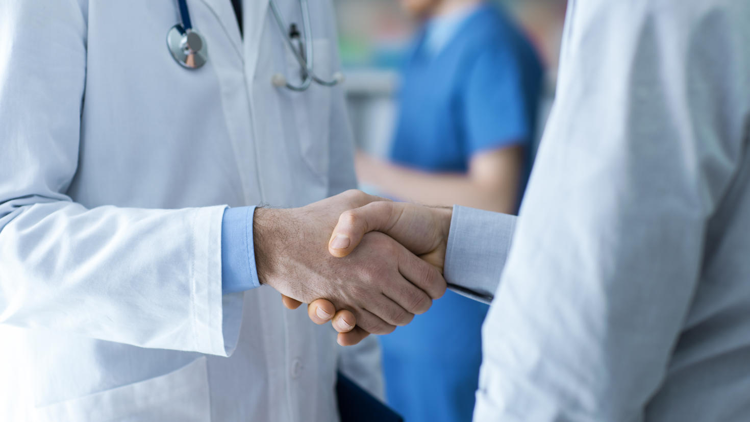 Two doctors shaking hands