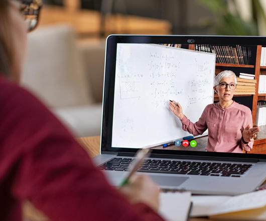 Pereson watching and taking notes on an online presentation