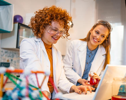 two female students doing research in a lab