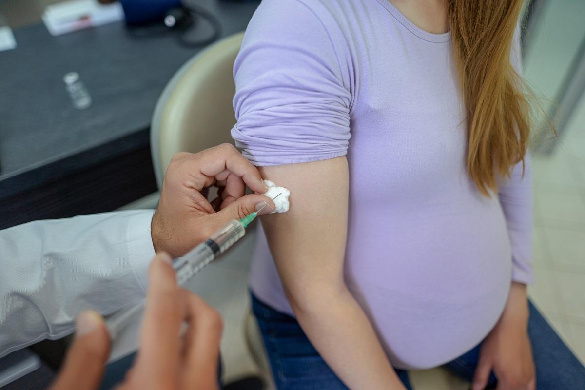 Pregnant woman being vaccinated