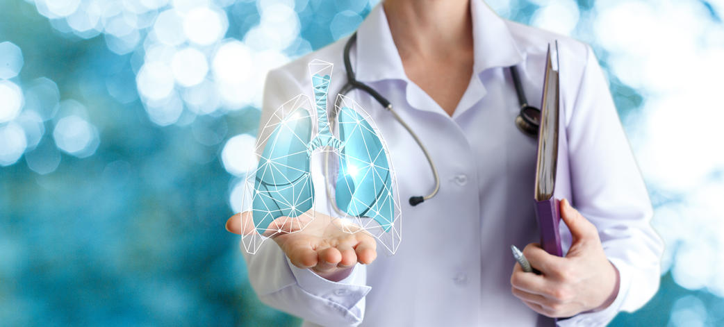Female professor holding virtual lungs in her hand