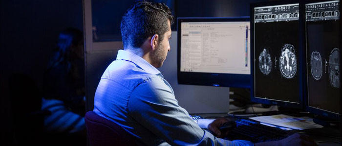 Physician reviewing an x-ray on a computer screen