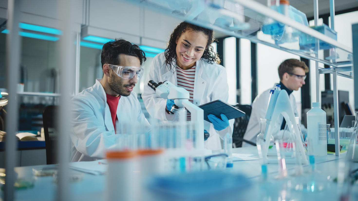 Scientists in a laboratory conducting experiments and analyzing samples