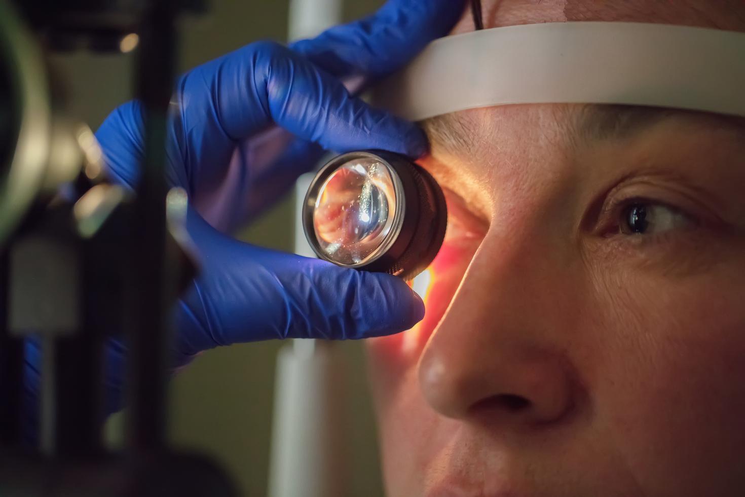 Lens being used to examine the eye of a patient