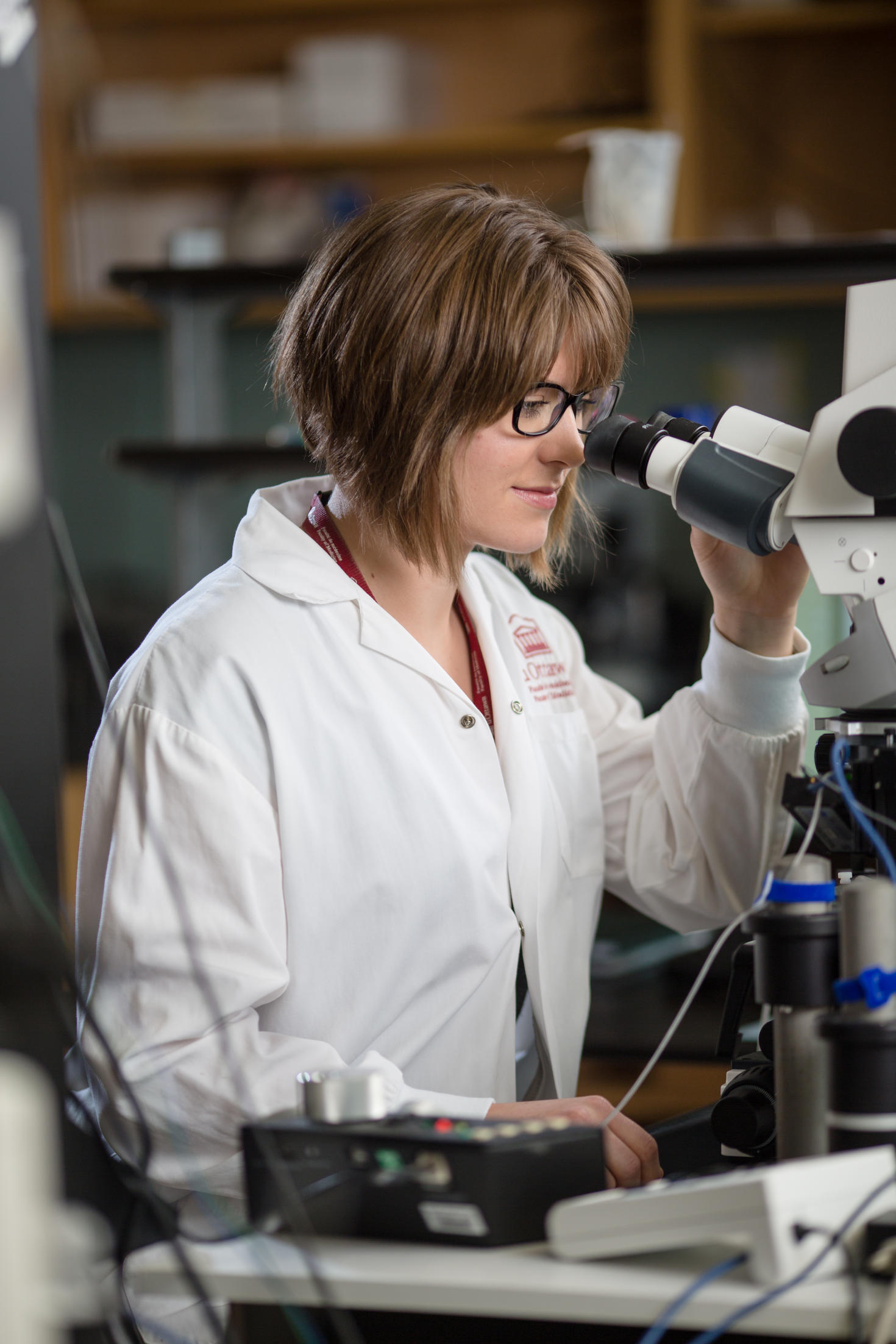Student looking in a microscope