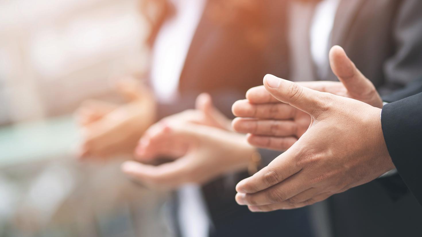 people are clapping hands