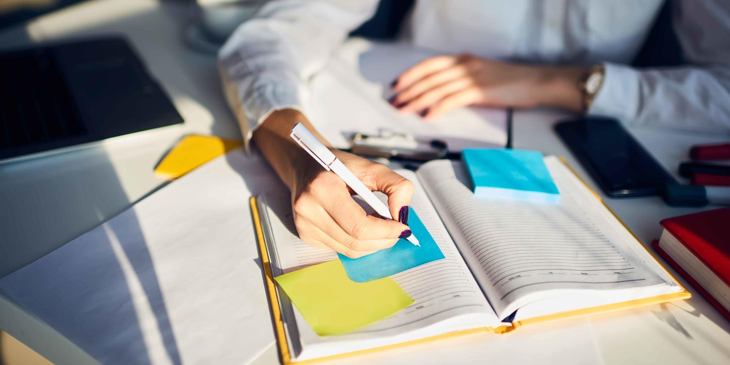a person taking notes