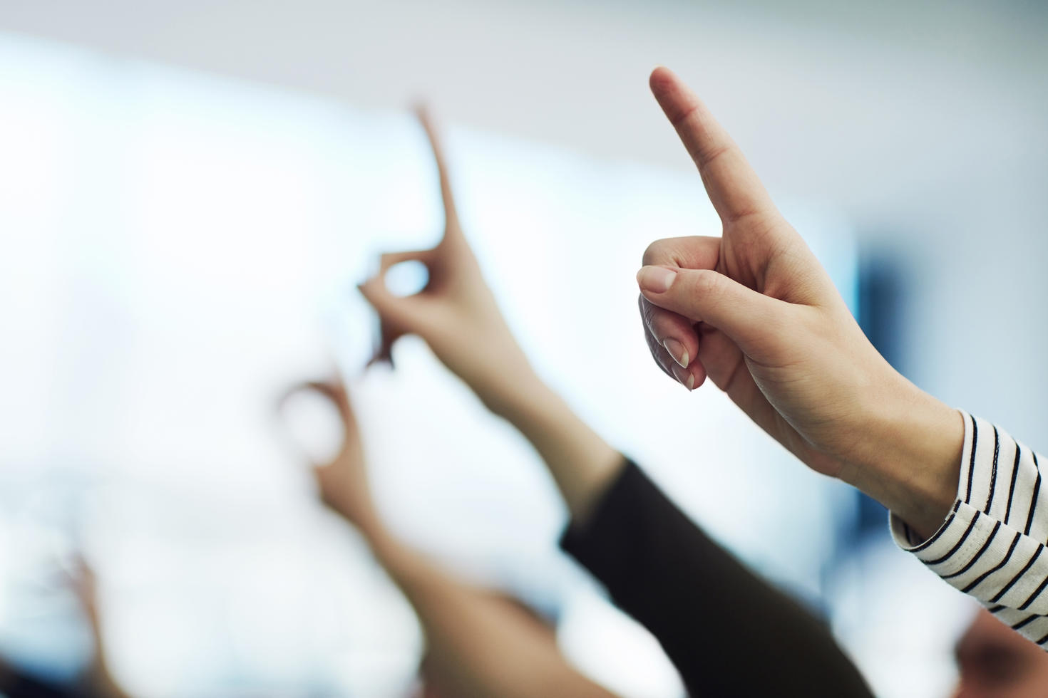 several raised hands