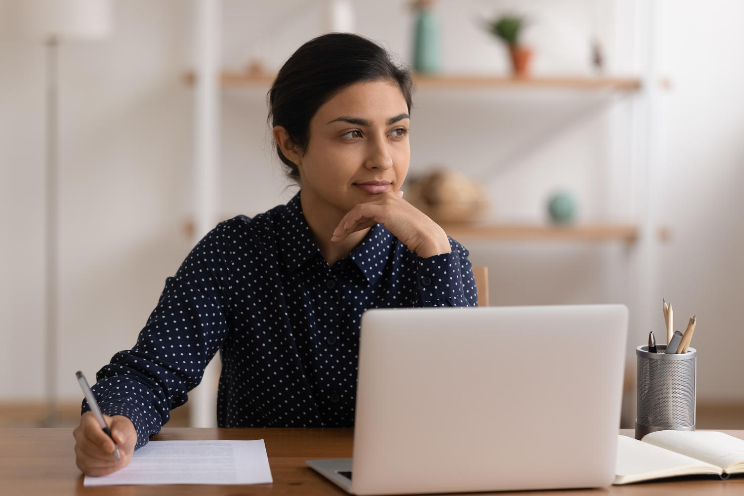 a woman working on her laptop