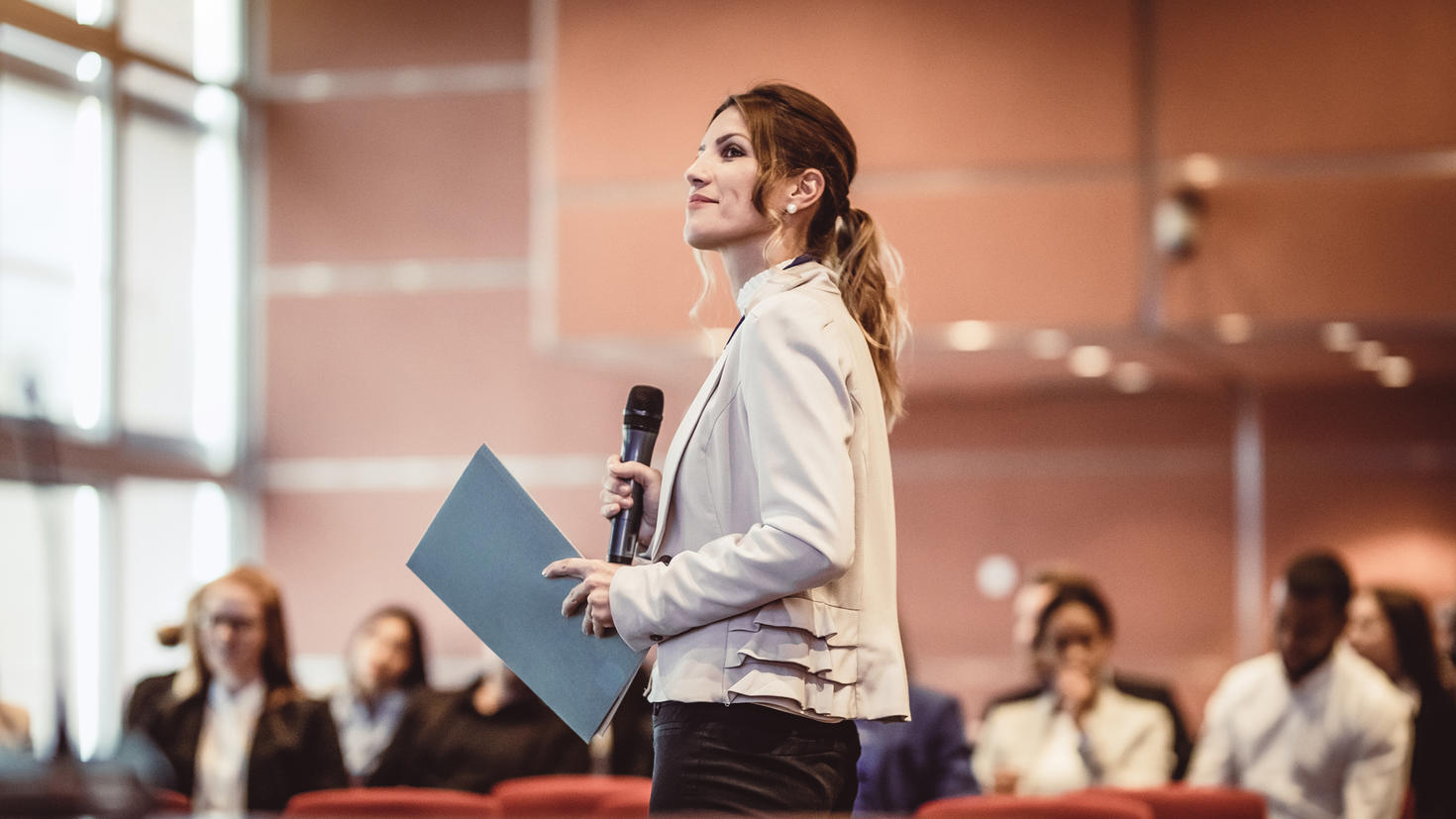 Female seminar speaker presenting