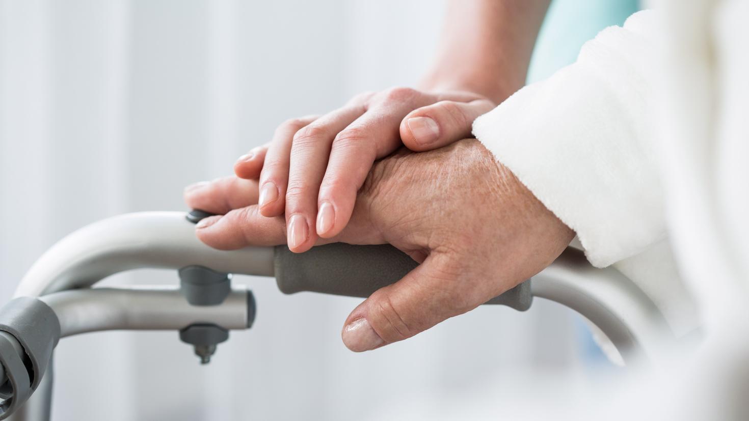 Supporting a lady in a nursing home