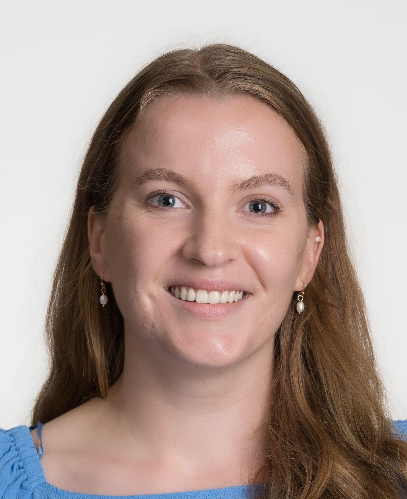 Katherine Cardwell smiling with a blank background.