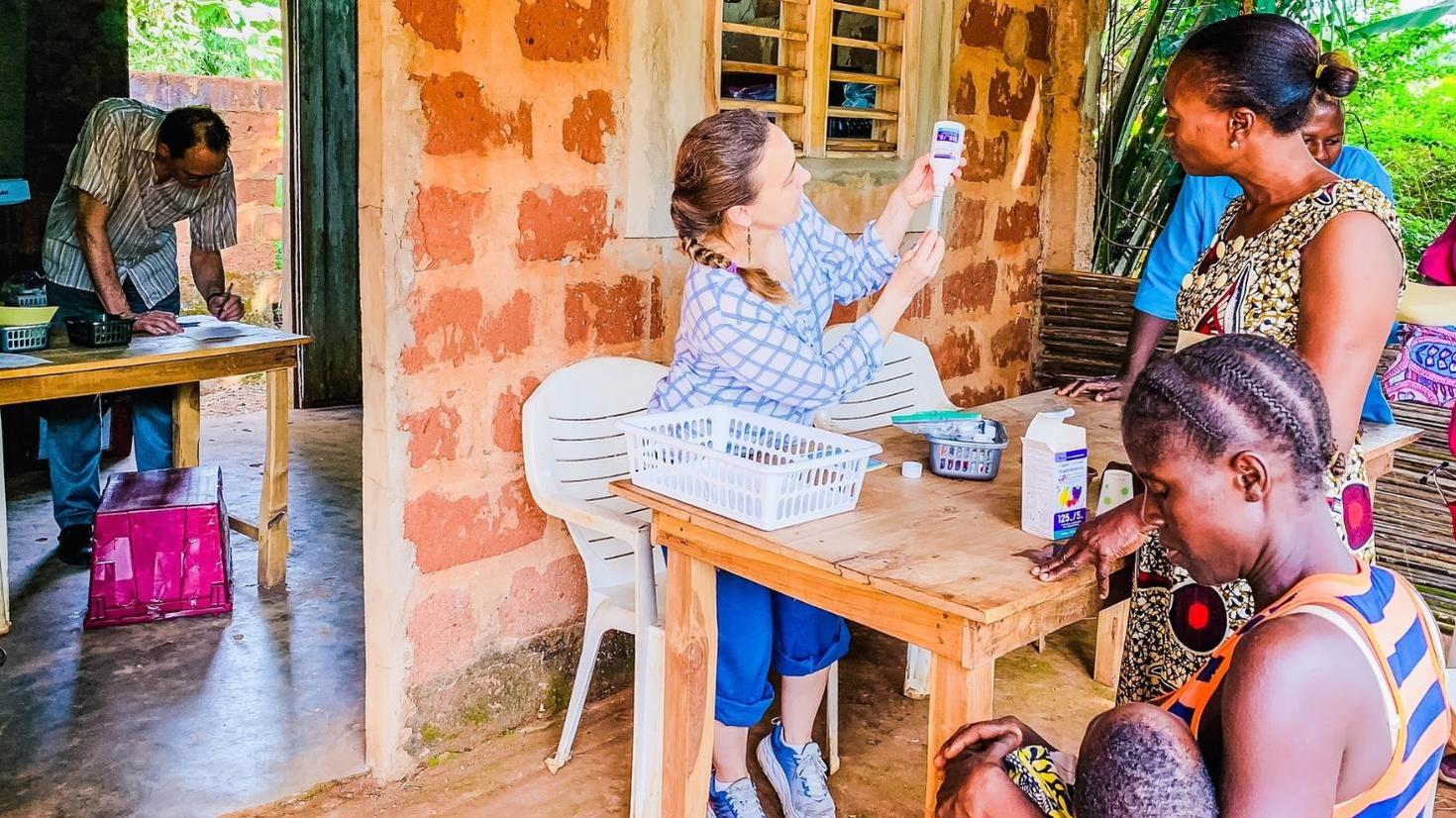 Resident with patients at a consultation