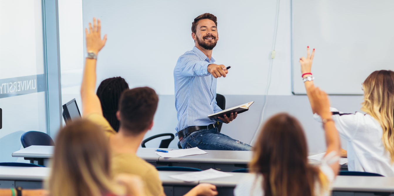 Raised hands in classroom