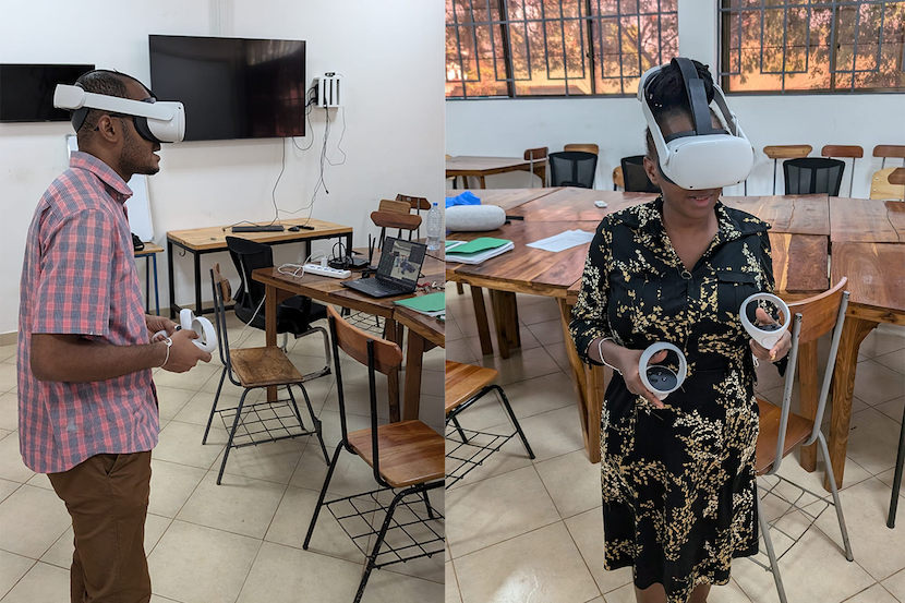 Two people wearing virtual reality headsets in a classroom.