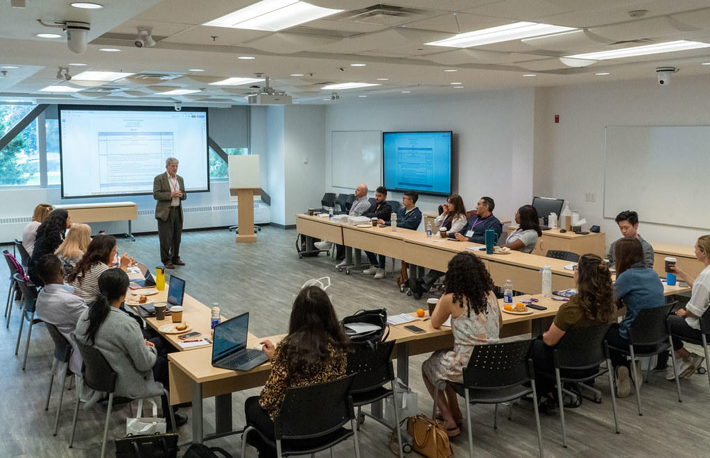 Dr. William Hogg, acting chair, addressing a room full of new faculty at the faculty orientation session in June of 2025