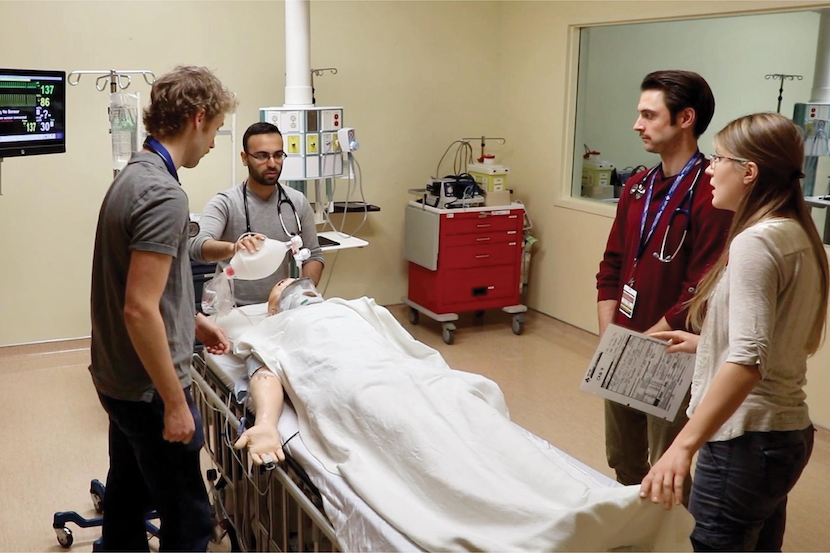 Learners learning medical techniques on a manekin