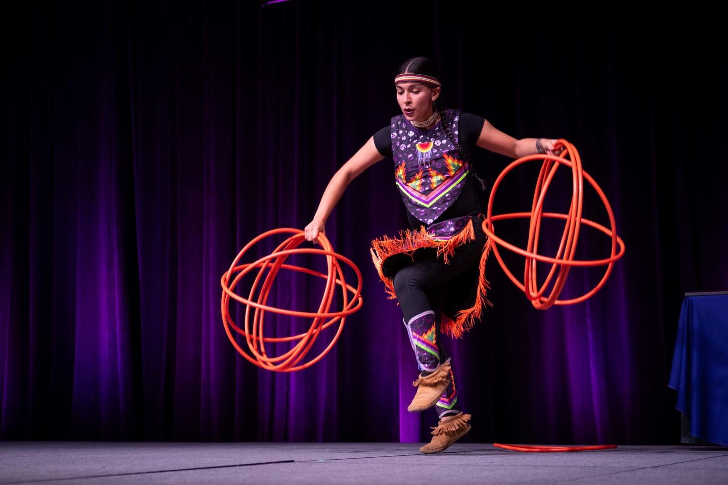 Two-Spirit Anishinaabe/Algonquin and French-Canadian artist Makhena Rankin Guérin performing her hoop dance - Photo credit: Mélanie Provencher