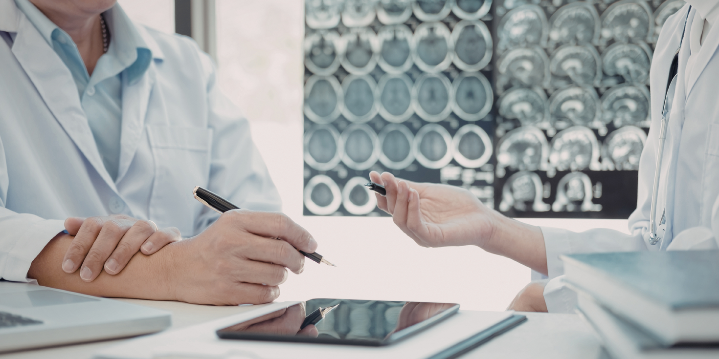 Doctors discussing information on tablet