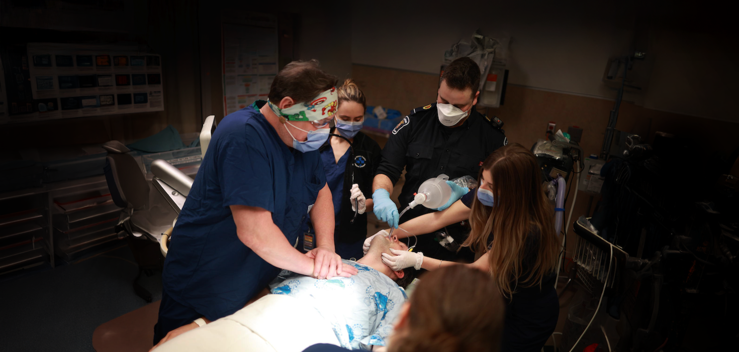 Doctors performing resuscitation on patient 