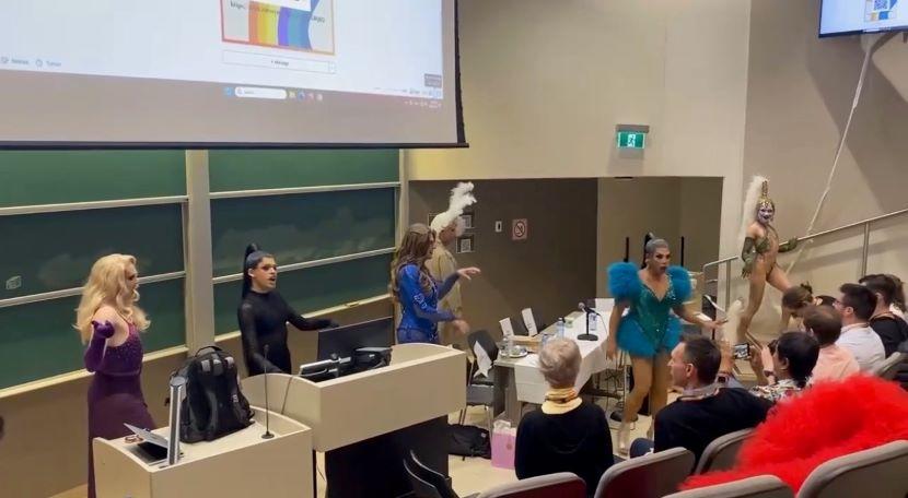 Members of the LGBTQ+ community, some dressed in drag, speak to attendees at the Queer Health Summit April 22.