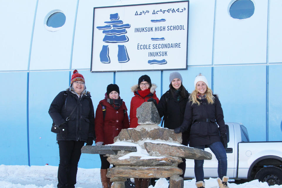 Dr. Chelsey Bertrand (centre in red coat) and classmates