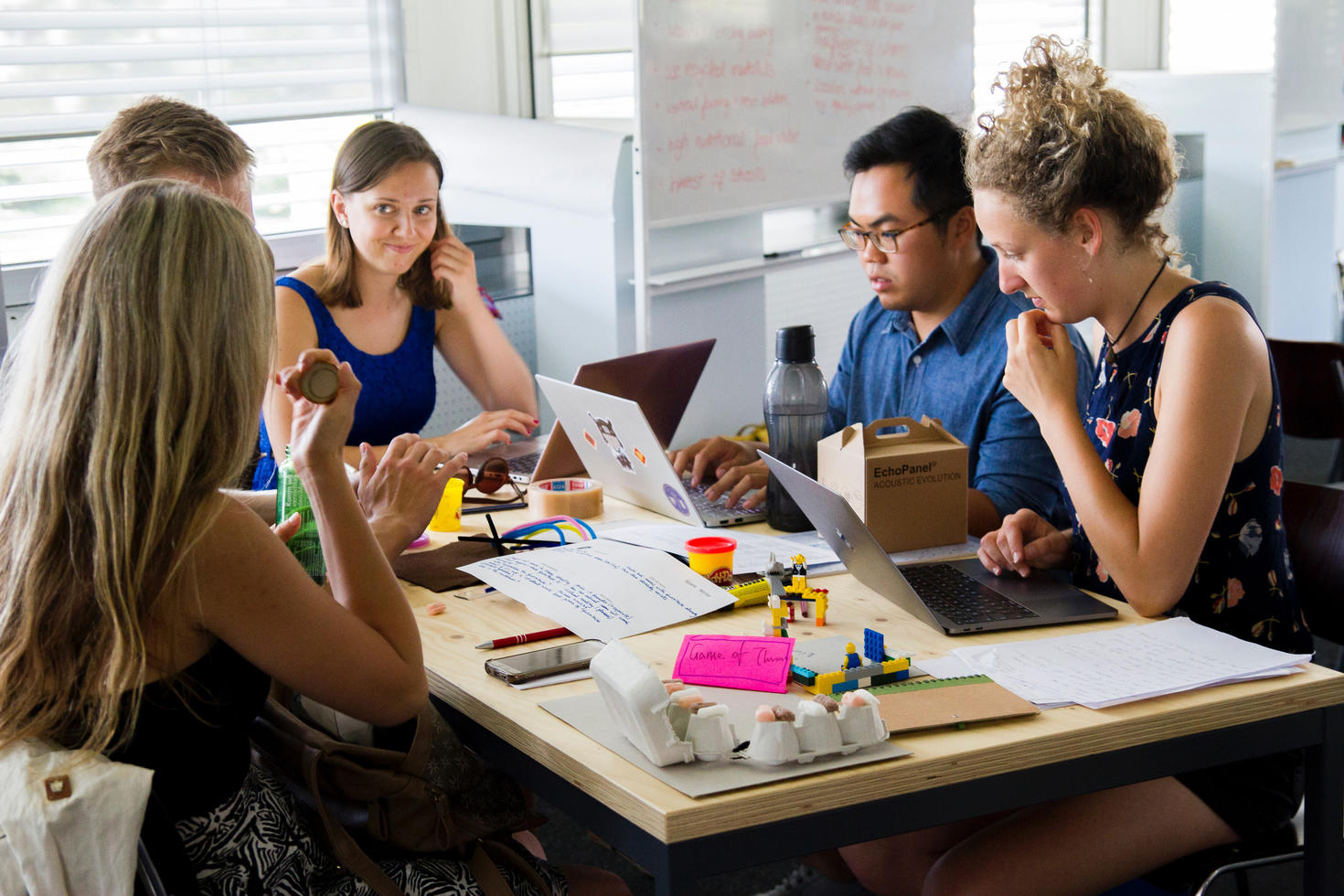 Group of people meeting at a table.
