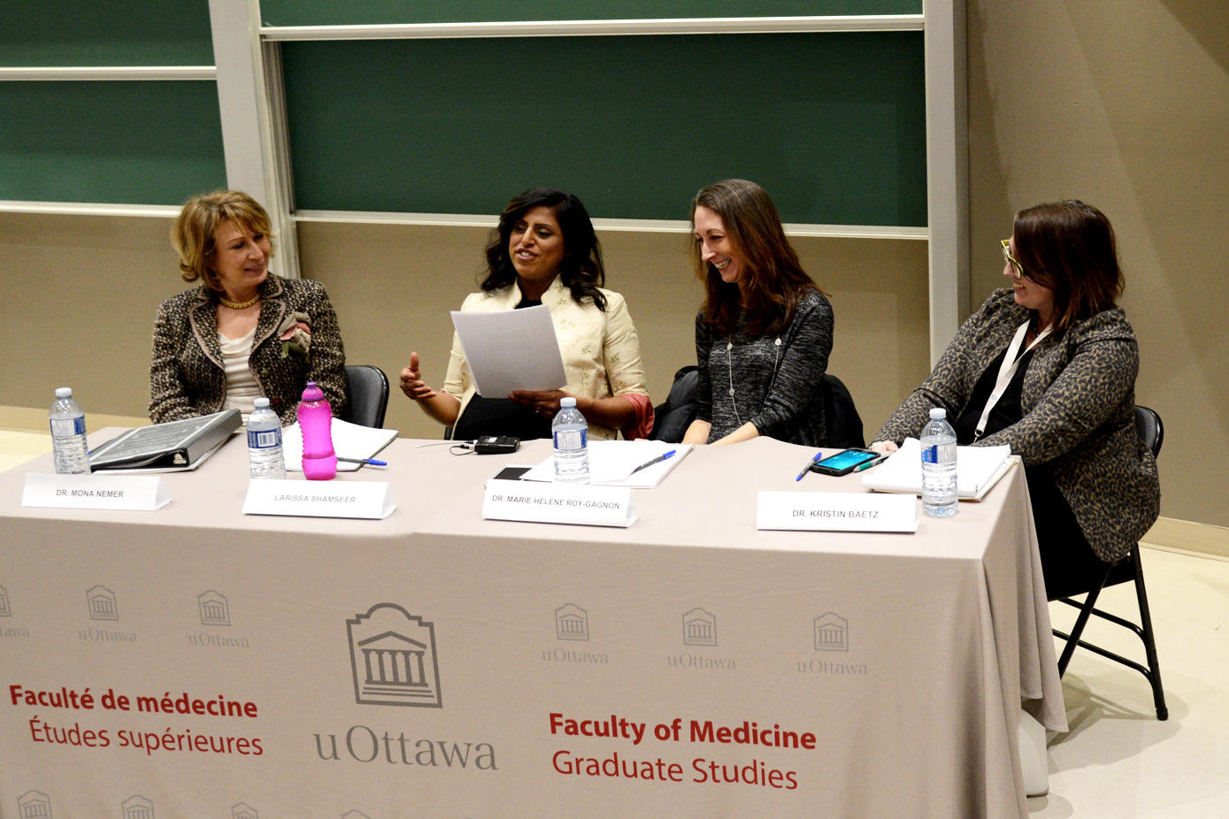 Dr. Mona Nemer, Larissa Shamseer, Dr. Marie-Hélène Roy-Gagnon and Dr. Kristin Baetz sitting at a table.