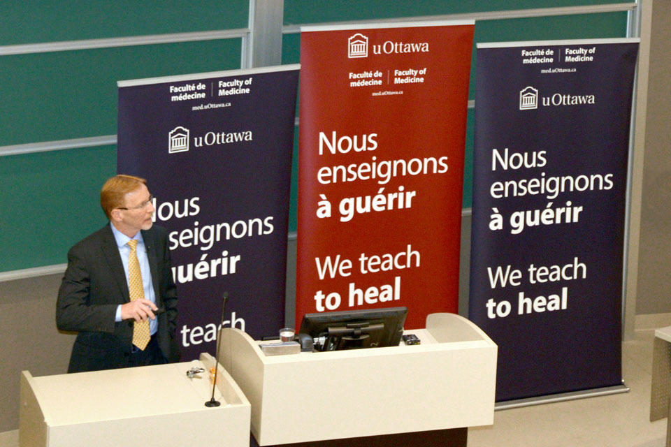 Dr. Bernard Jasmin speaking at the town hall.