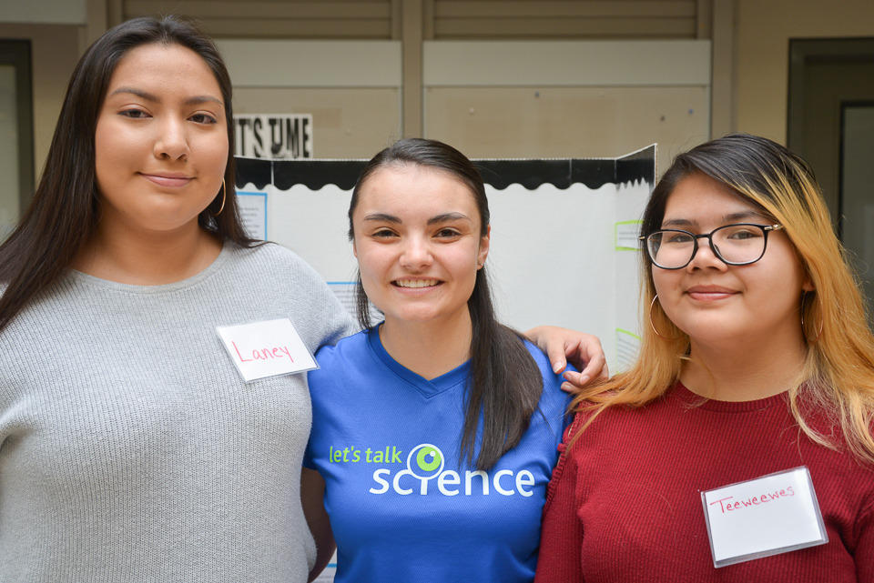 A photo of Taylor Jamieson and two of the students she has mentored in the Program.