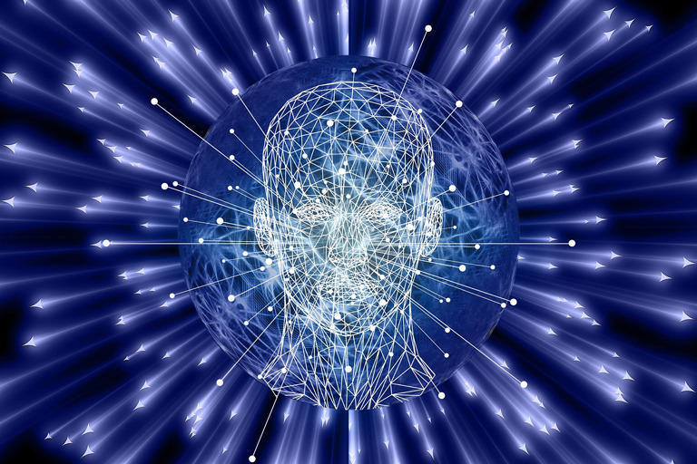 Graphic of the human head surrounded by laser beams