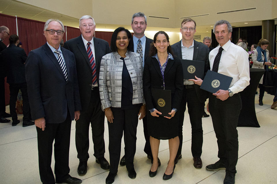 Dr. Sharon Whiting (interim vice dean, Faculty Affairs), and Dr. Ciaran Duffy, chair, Paediatrics, celebrate with newly promoted faculty members at the Professorial Promotions Ceremony in April 2018. 