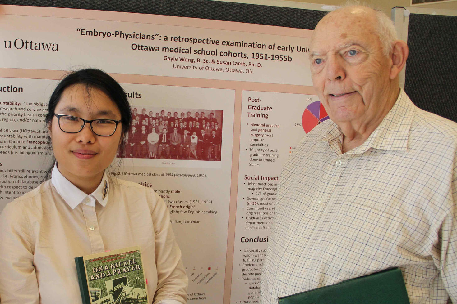 Photo of Gayle Wong and Dr. George Taylor standing in front of her poster.