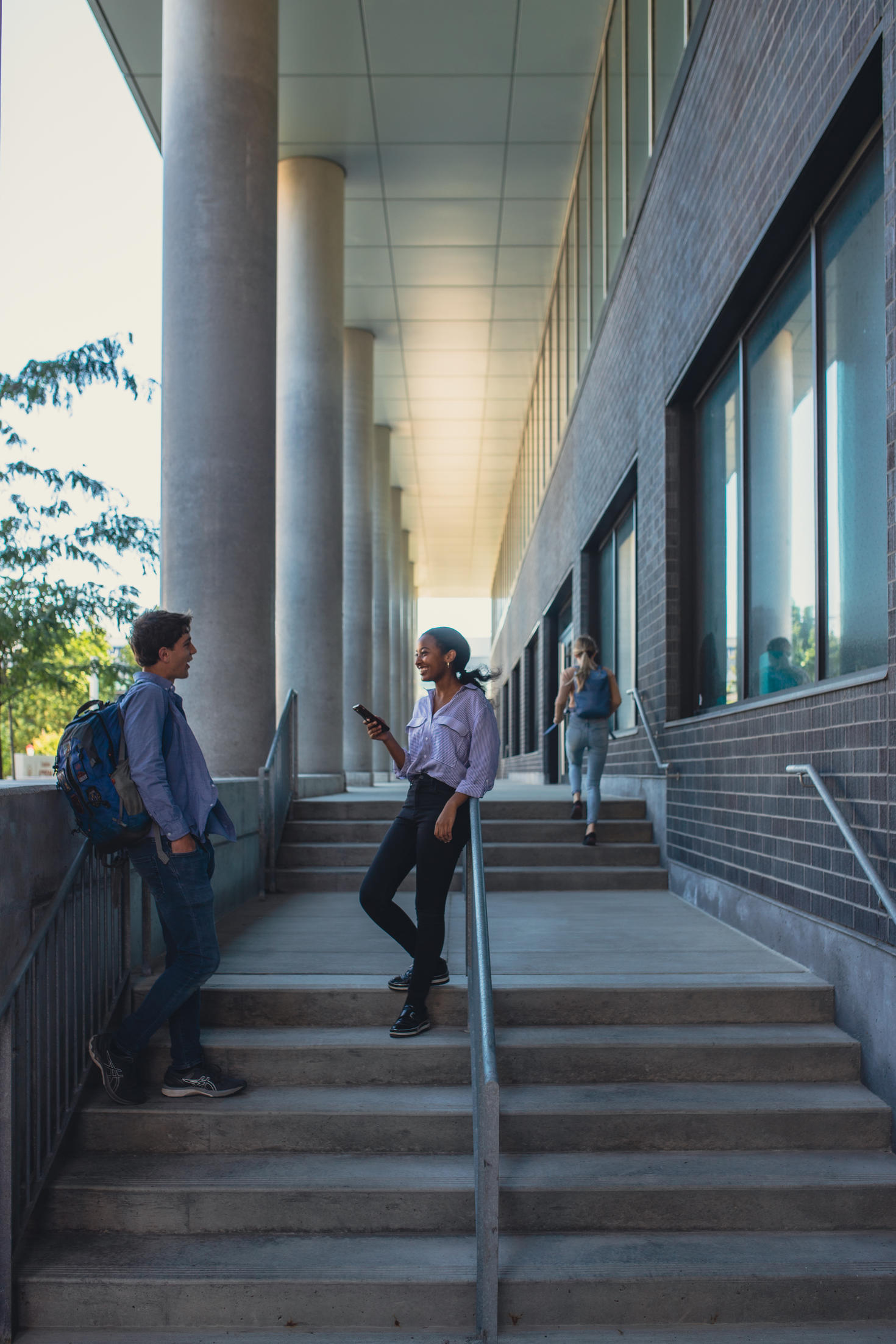 Students talking on the STEM complex outside stairs