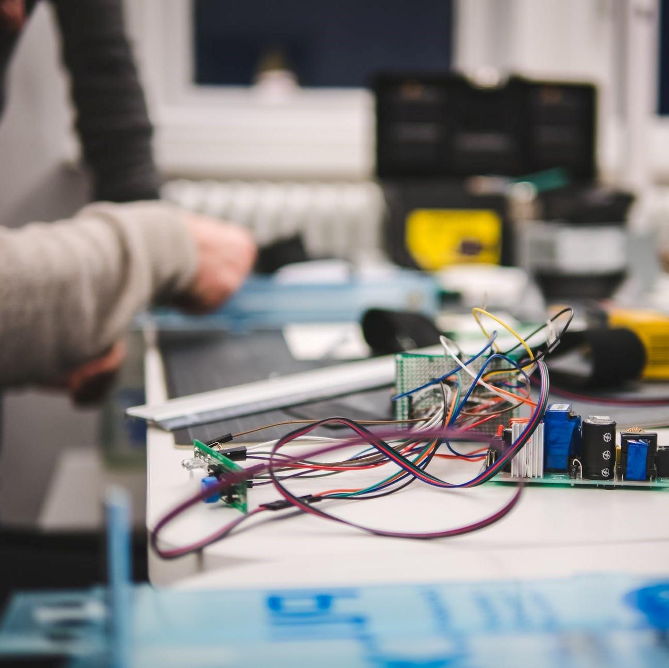 Close up on hands working with electrical 