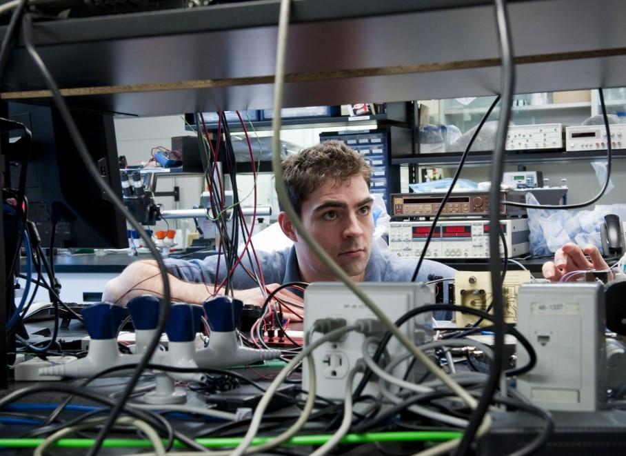 Research working on equipment in a Physics lab