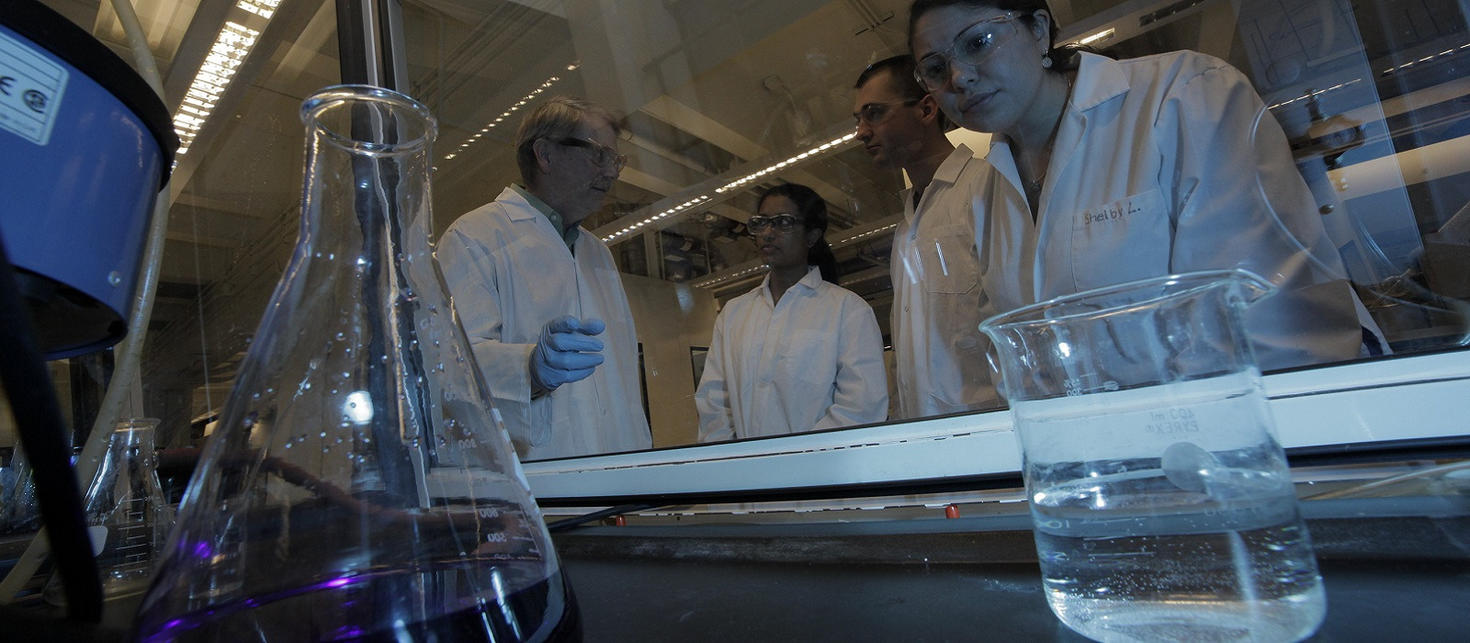 Scientists talking in a lab