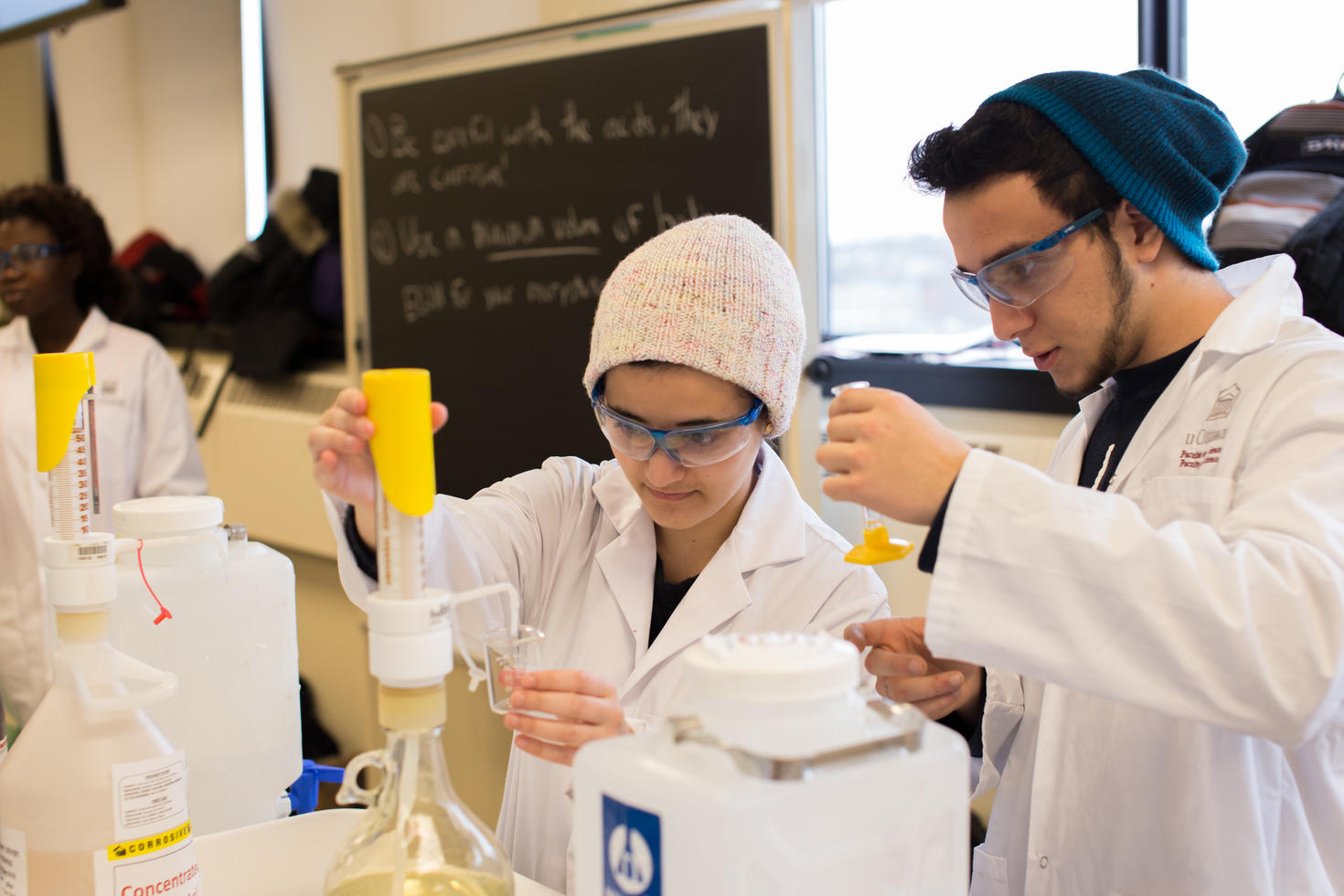 Two students working in a chemistry teaching lab