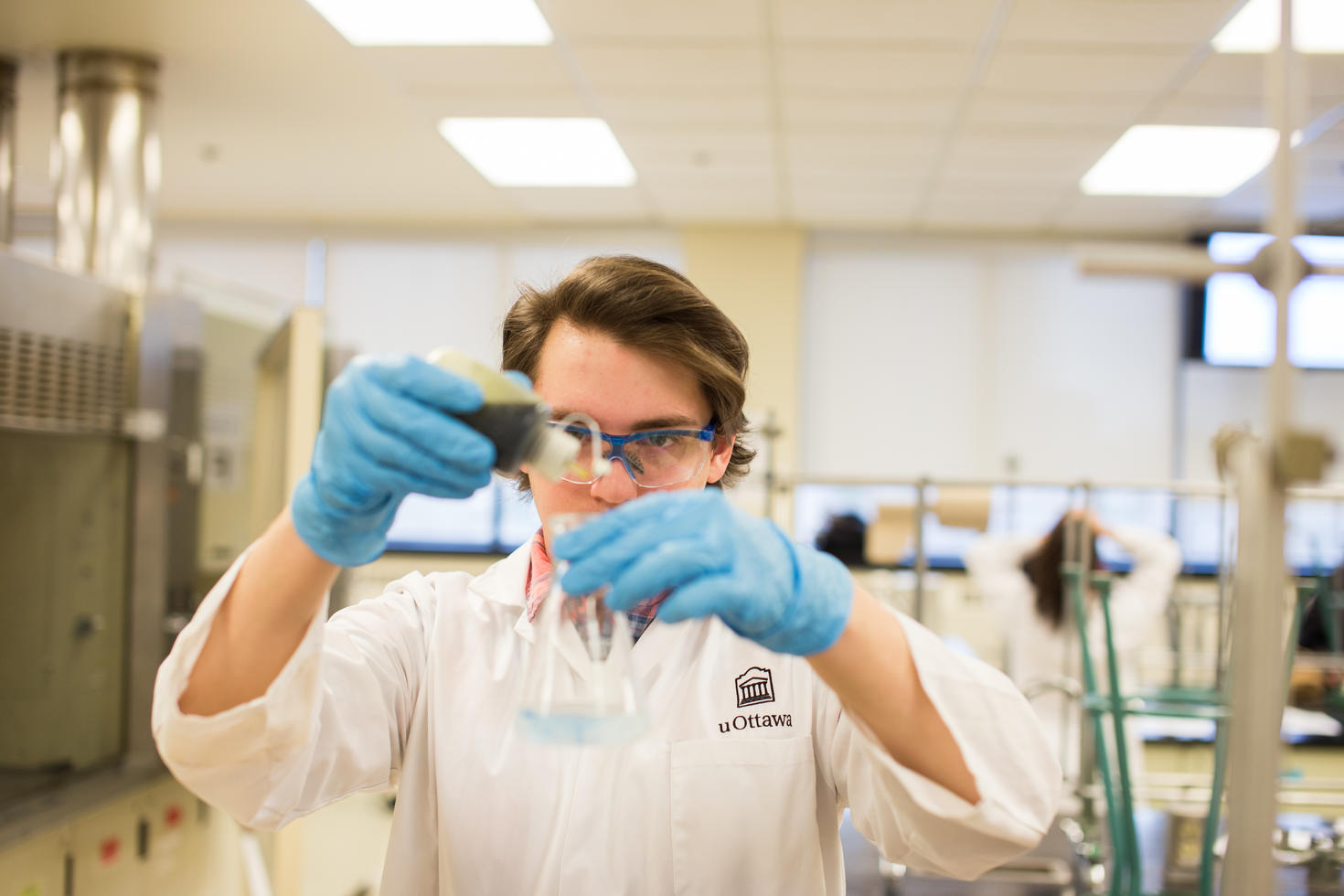 Student working with samples in chemistry lab