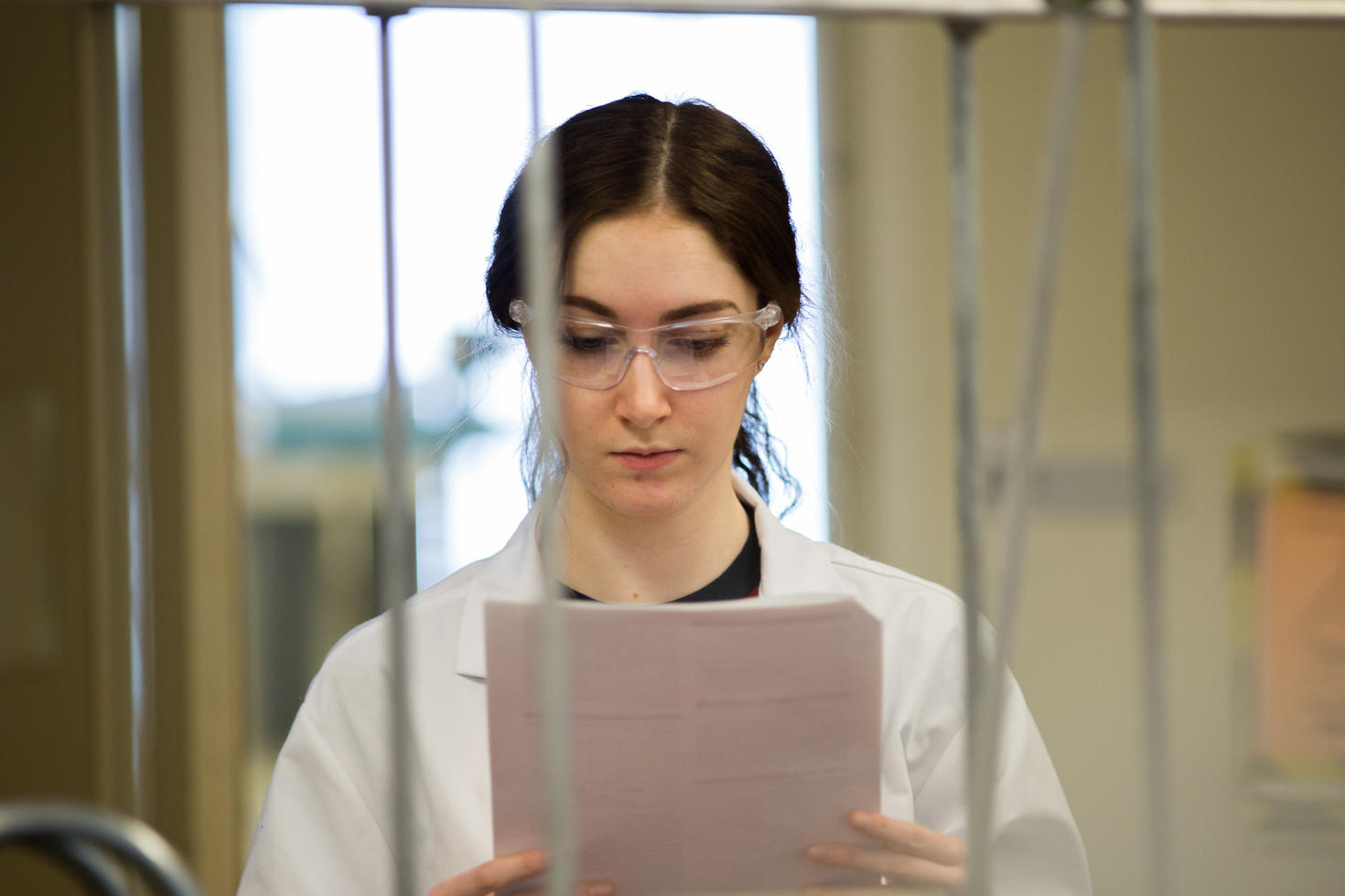 Female student looking at lab report