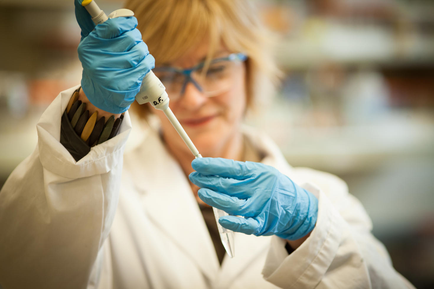 Researcher measuring samples